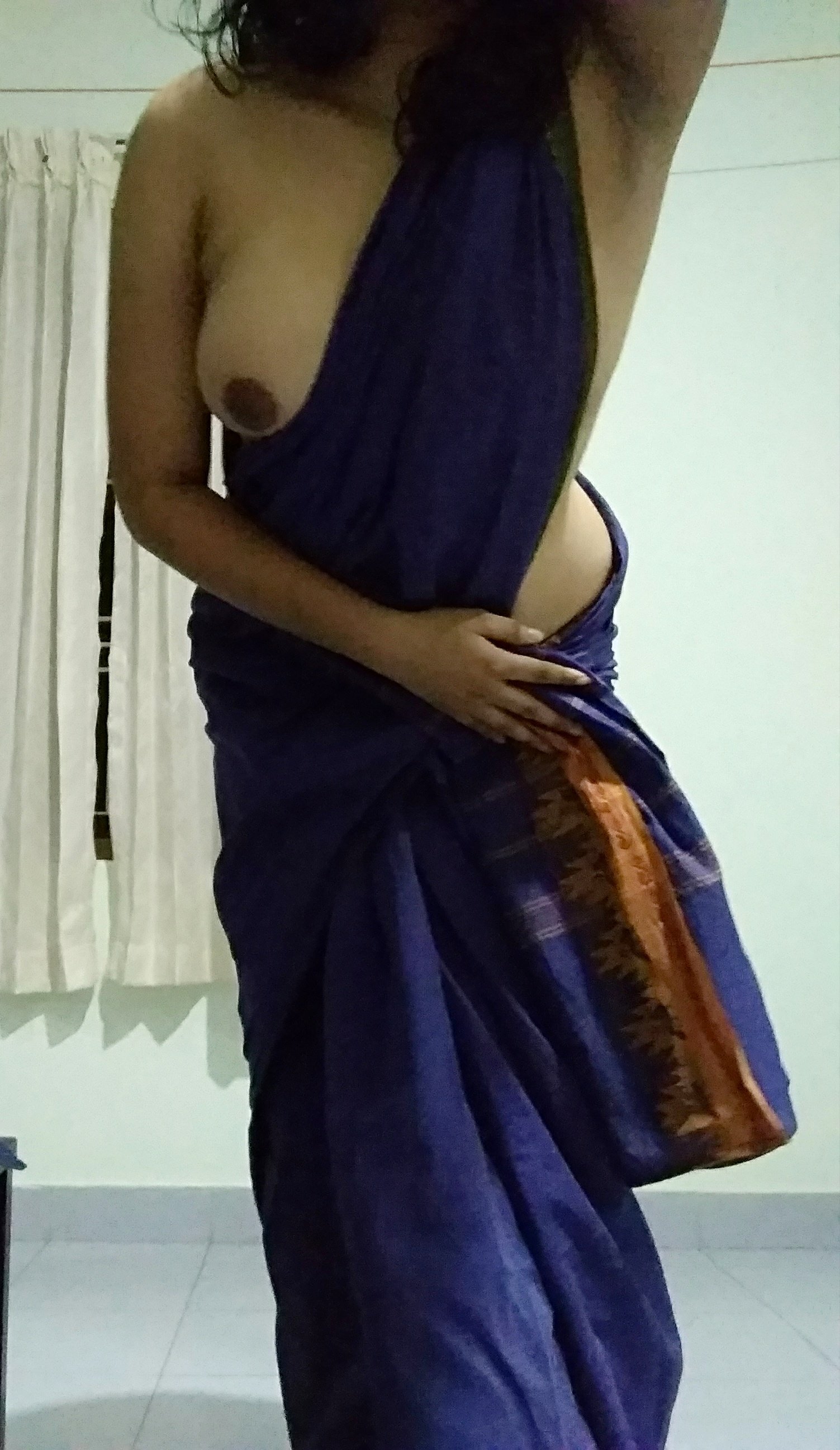 Wearing saree